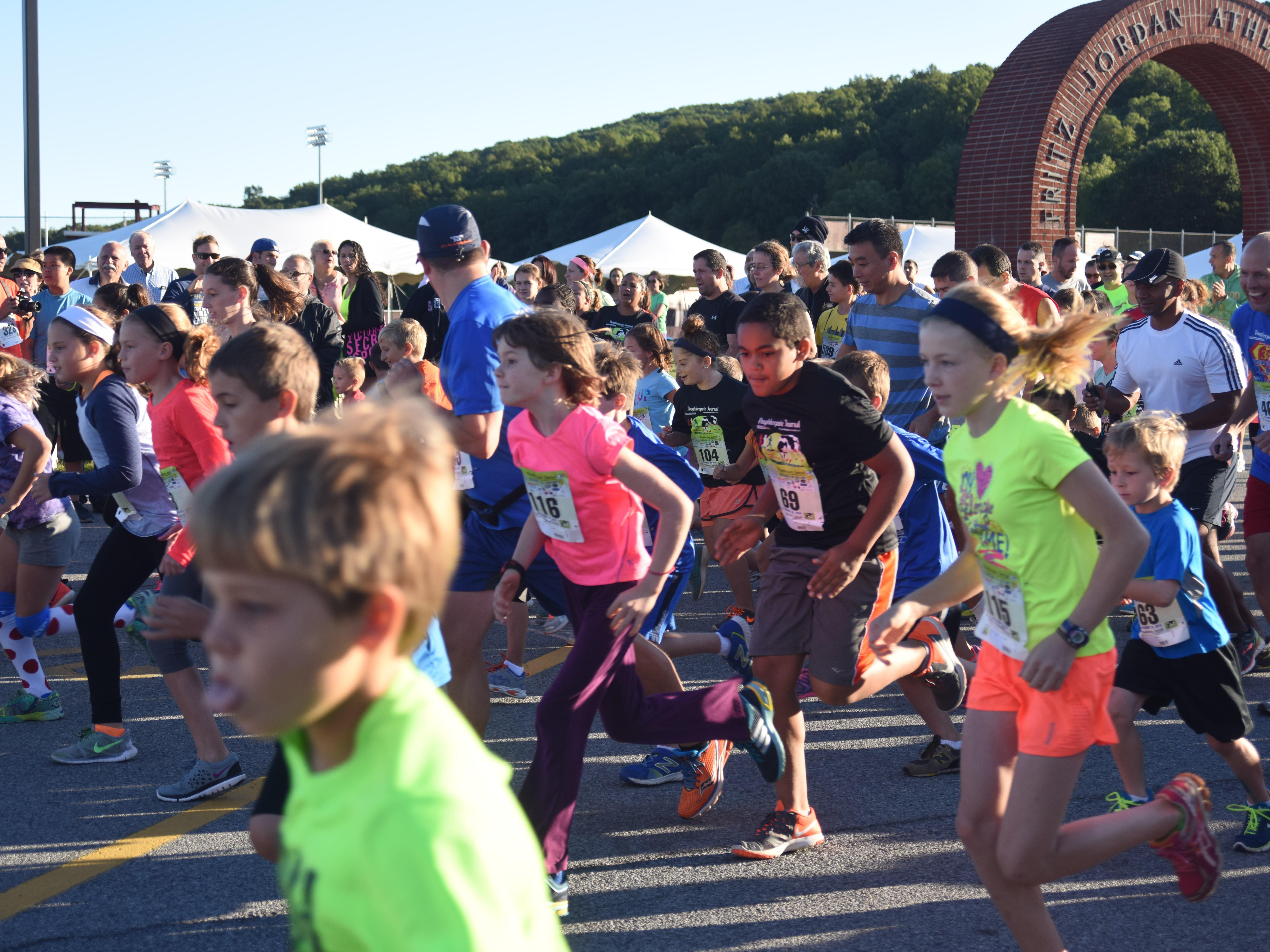 Runners begin the one-mile kids race, part of the Dutchess County Classic held at Arlington High School last year.