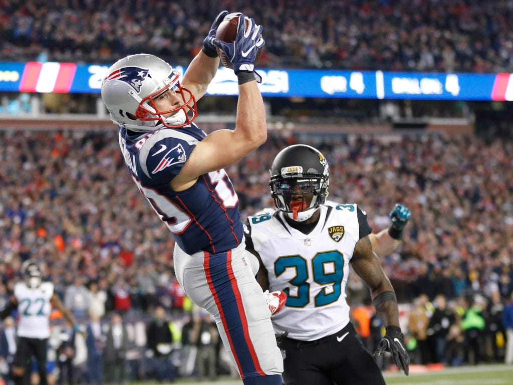 New England Patriots wide receiver Danny Amendola catches a touchdown pass ahead of Jacksonville Jaguars free safety Tashaun Gipson during the fourth quarter in the AFC Championship Game at Gillette Stadium in Foxborough, Mass.