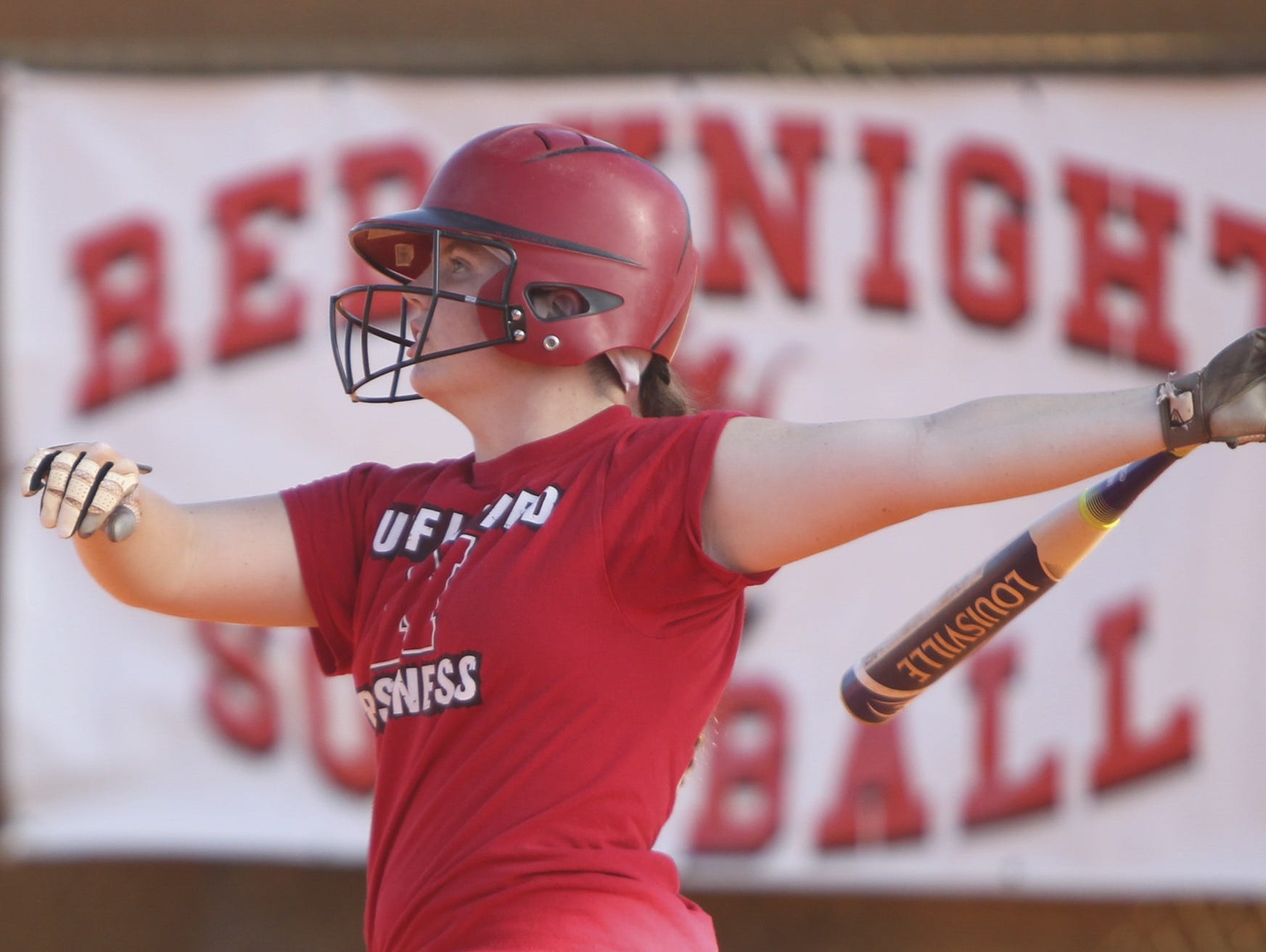 Shelby Coyne watches the trajectory of a softball during batting practice at North Fort Myers High School Thursday.