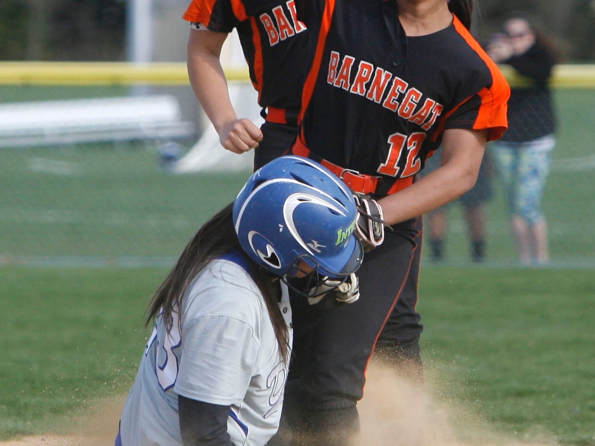 Barnegat's Tymera Crudup forces Donovan Catholic's Rebecca Drake at second base but fails to turn the double play at St. Jospeh's Church Parish Fields in Toms River May 1, 2015.