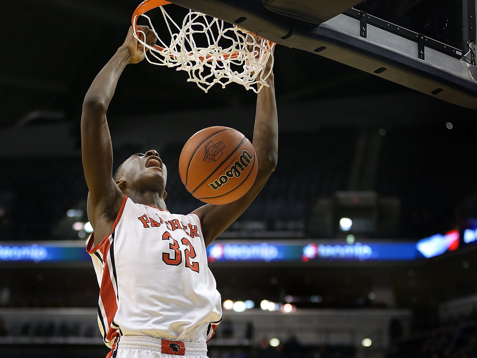 Park Tudor's Jaren Jackson Jr., dunks on Frankton's Maurice Knight,right, during their ISHAA 2A State Championship game. The Park Tudor Panther defeated the Frankton Eagles 73-46 to win the IHSAA 2A Boys Basketball State Final Saturday, March 28, 2015, afternoon at Bankers Life Fieldhouse.
