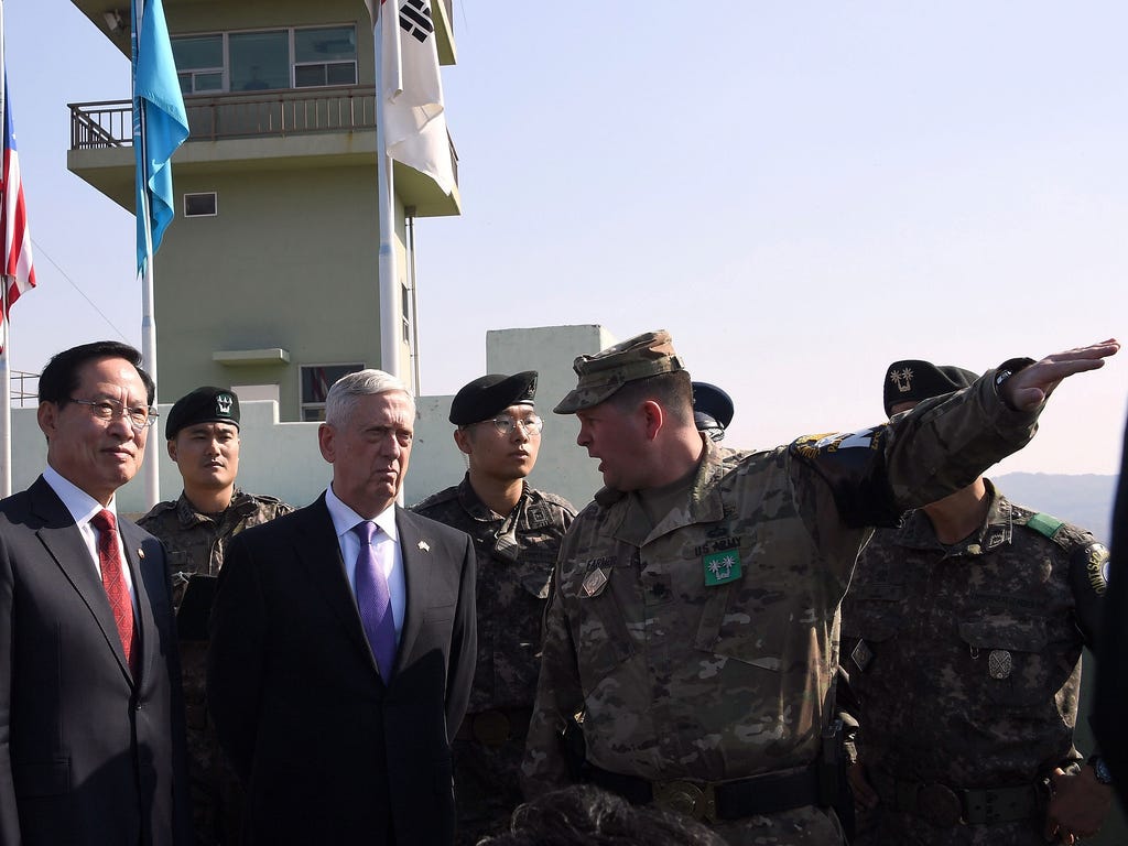 Secretary of Defense James Mattis (C) and South Korean Defense Minister Song Young-moo (L) visit Observation Post Ouellette near the truce village of Panmunjom in the Demilitarized Zone (DMZ) on Oct. 27, 2017 in Panmunjom, South Korea. Mattis is in S