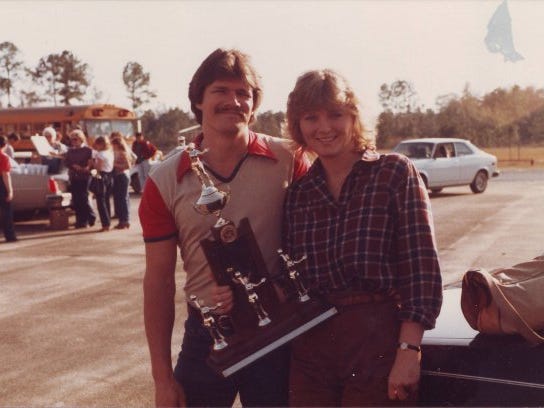 Susie Morris, with husband Kirby, after winning a district title early in her coaching career at Munroe.