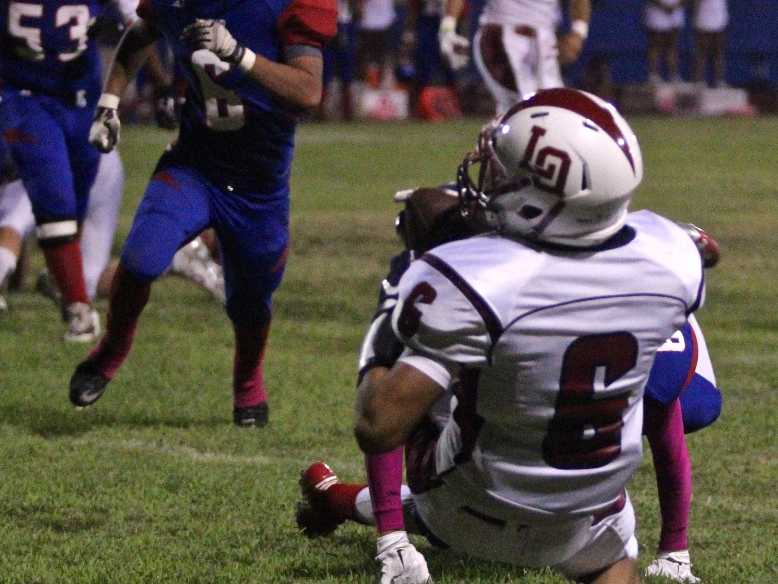 La Quinta’s Joshua Cabrera (6) catches a pass and scores a touchdown at Indio High School on Friday.
