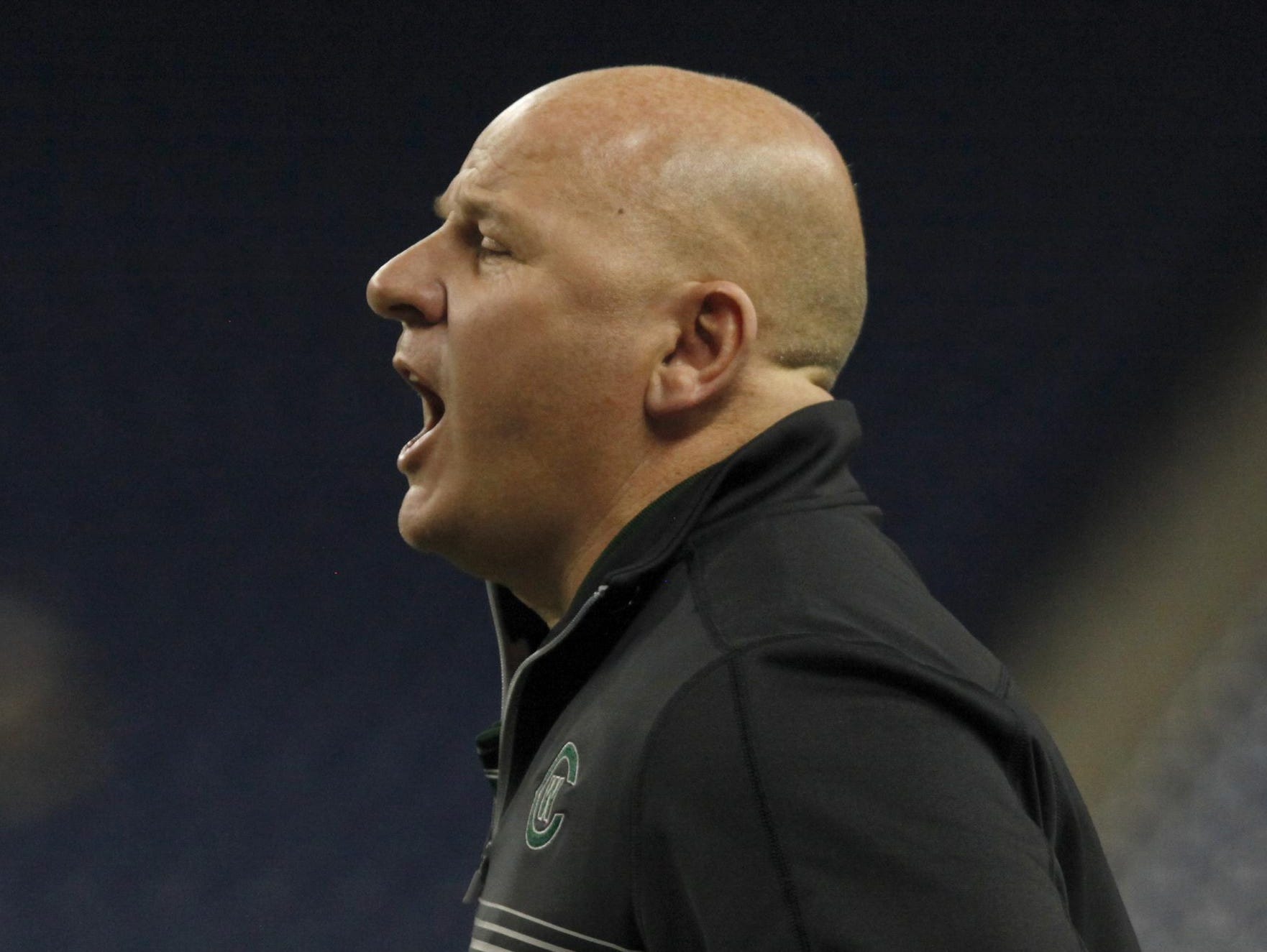 Grand Rapids West Catholic head coach Dan Rohn directs his team Saturday at Ford Field.