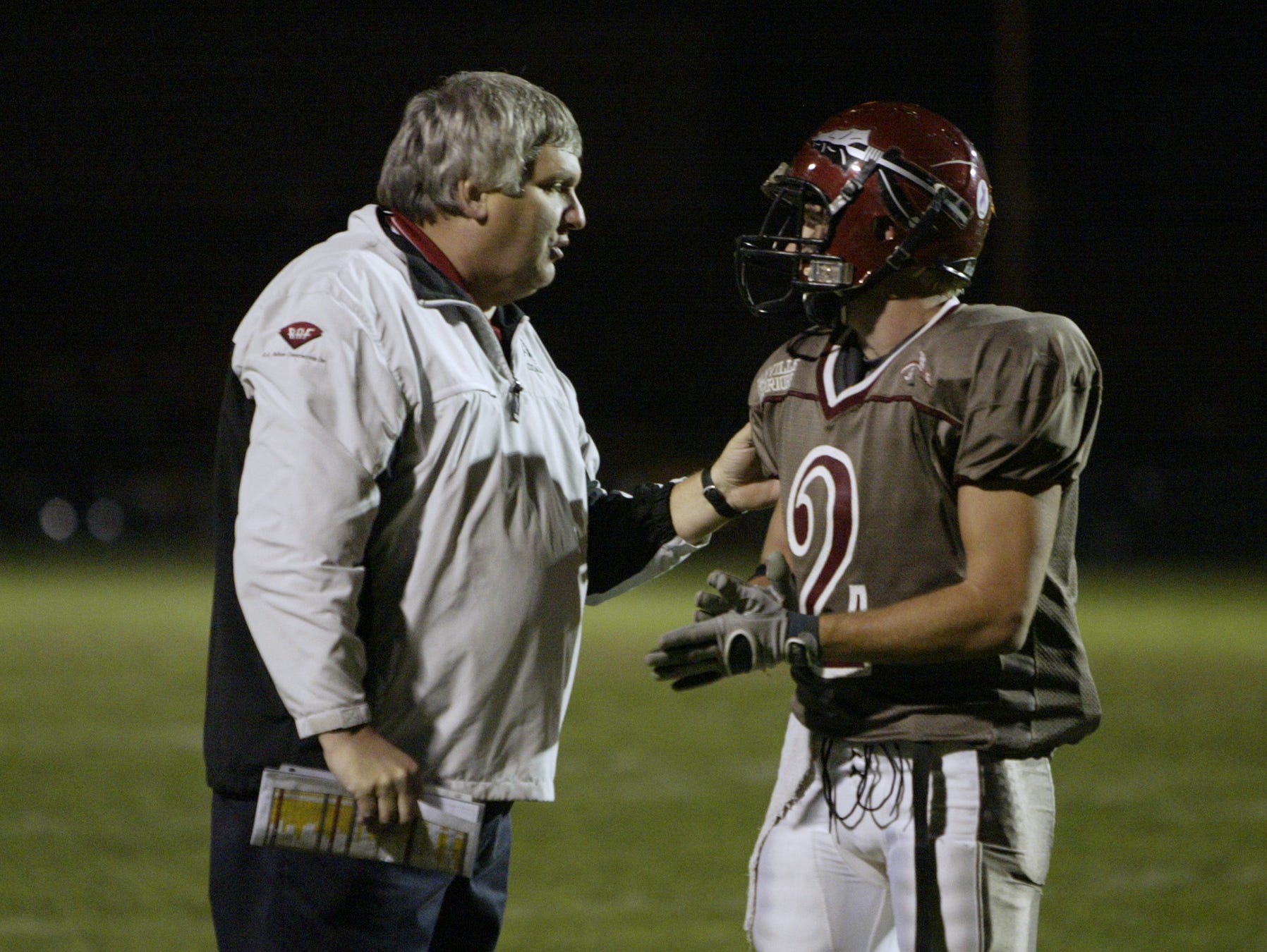 FILE – Danville coach Terry Siddall talks to receiver K.C. Woods (2) in Class 3A Sectional 21 title game, Nov, 2, 2007. Woods was named Danville's coach on Monday.
