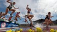 Runners race over the water jump during the women's