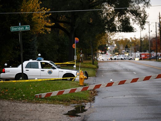 Officers investigate the scene at Merle Hay and Sheridan