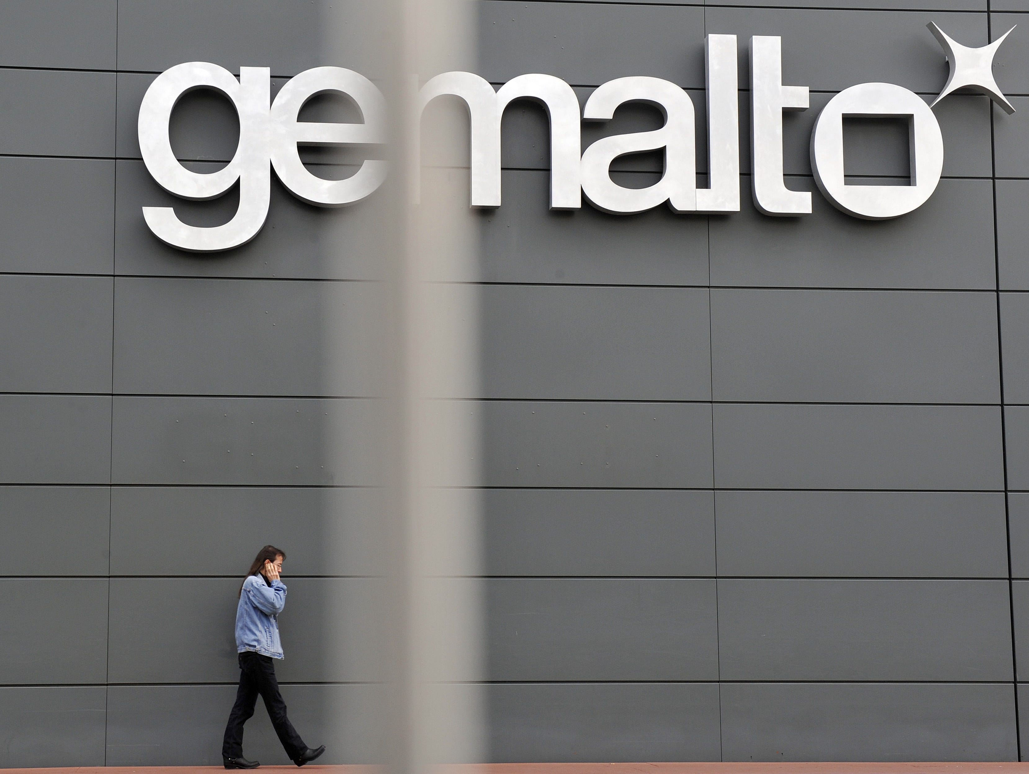 An employee walking outside the Gemalto building in Gemenos, southern France.