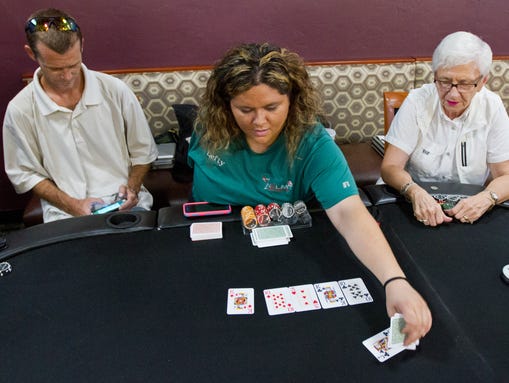 Heather "Lefty" Shneck, 36, manages a poker game at