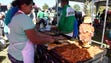Mexican soccer fans grill before the start of the game