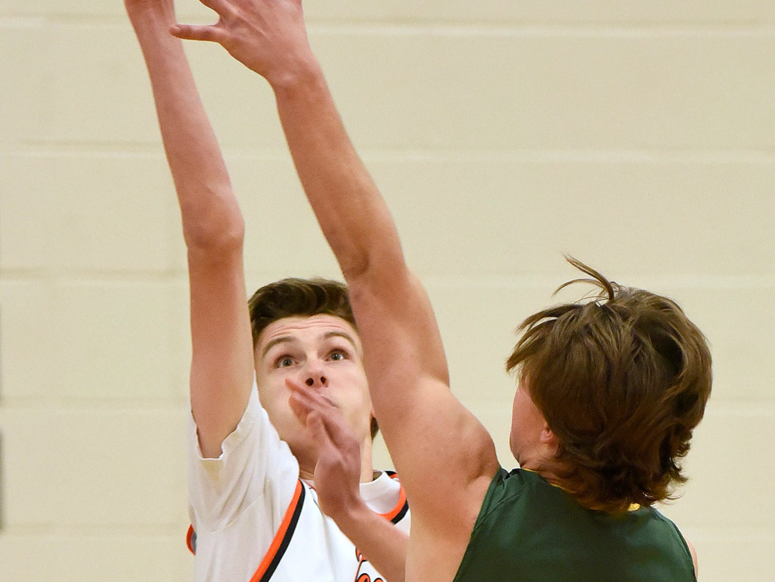 St. Cloud Tech's Trevor Koenig blocks a shot by Sauk Rapids' Tyler Kranz under the basket during the second half Tuesday, Dec. 1, at Sauk Rapids-Rice High School.
