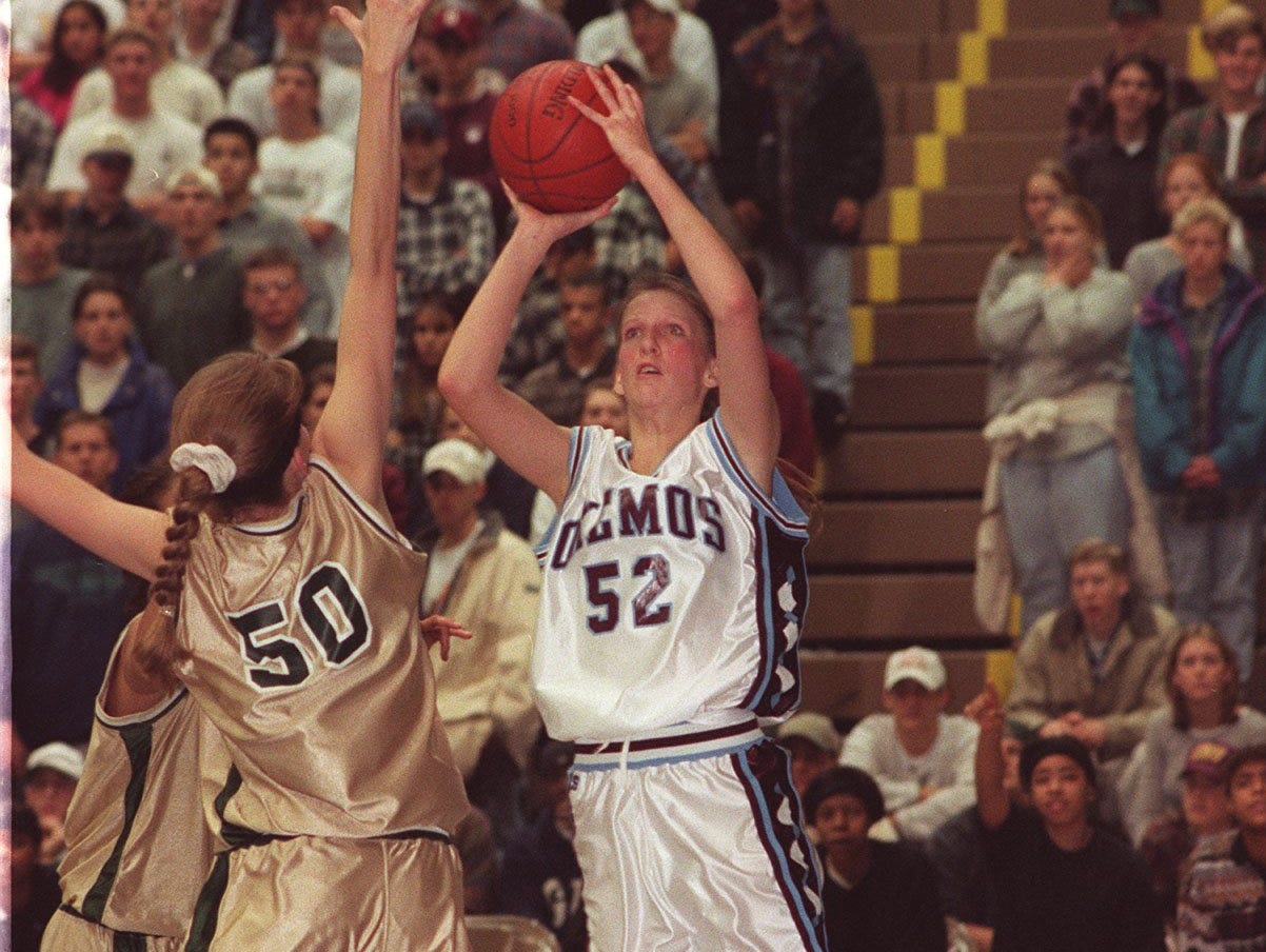 Okemos' Kristen Rasmussen (52) puts up a shot against Ann Arbor Huron during a game in 1995. She was hired as Okemos girls basketball coach Monday.