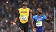 Usain Bolt (JAM) celebrates after winning the men's
