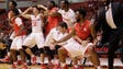 The Houston Cougars bench celebrates a dunk against
