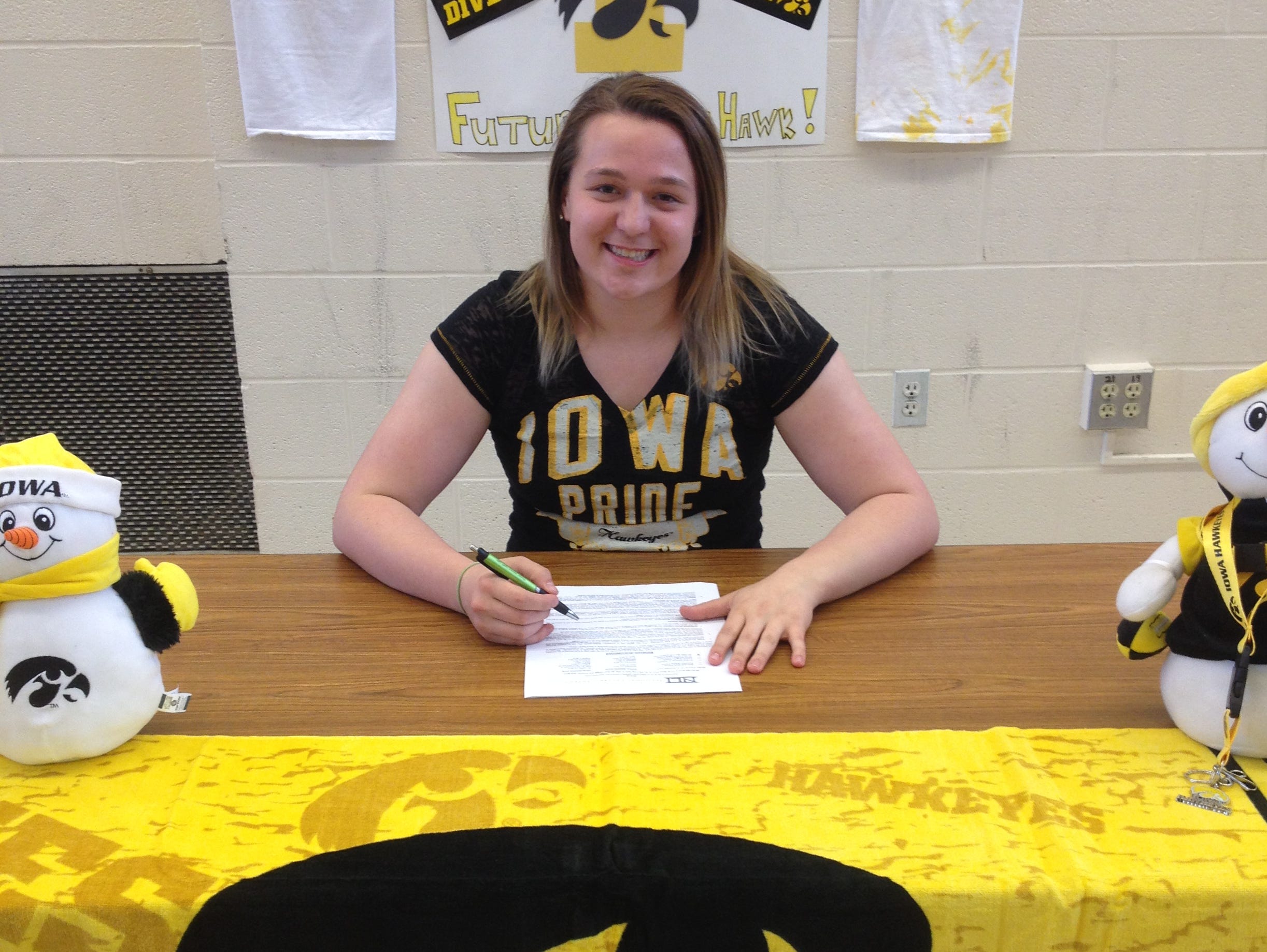 West High senior diver Jacintha Thomas signed a National Letter of Intent with Iowa on Wednesday. Thomas broke a state meet record with 561.10 total points last November.