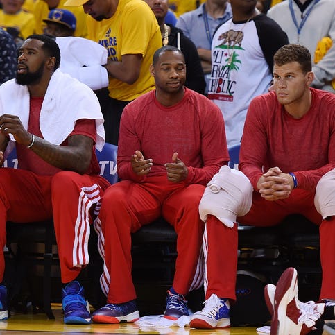 OAKLAND, CA - APRIL 27: Los Angeles Clippers players sit on the bench wearing their warm-up tops inside out against the Golden State Warriors in Game Four of the Western Conference Quarterfinals during the 2014 NBA Playoffs at ORACLE Arena on April 27, 2014 in Oakland, California. The players wore theirs warm up this way in protest of owner Donald Sterling's racially insensitive remarks. NOTE TO USER: User expressly acknowledges and agrees that, by downloading and or using this photograph, User is consenting to the terms and conditions of the Getty Images License Agreement. (Photo by Thearon W. Henderson/Getty Images)