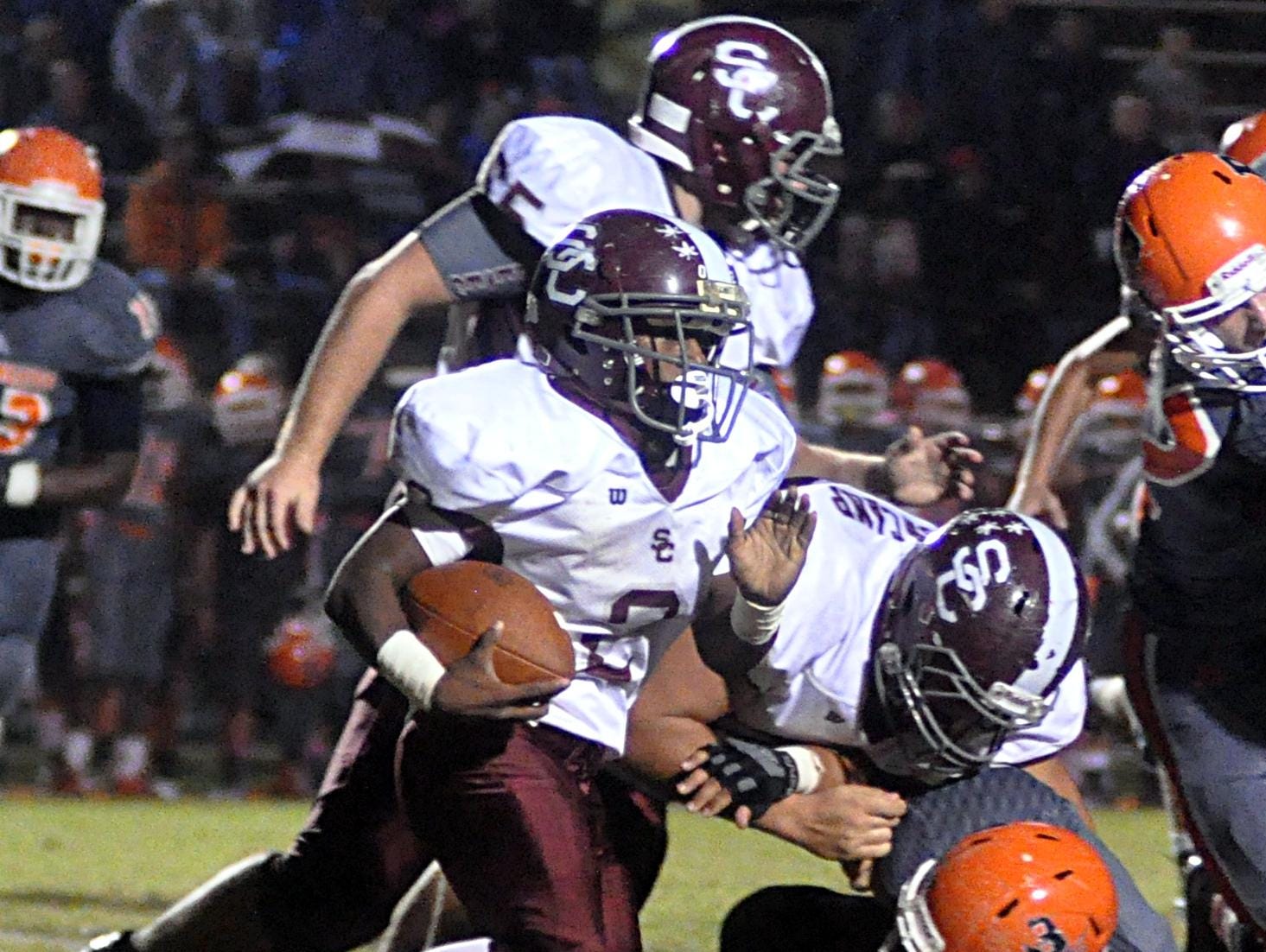 Station Camp High sophomore Kaemon Dunlap carries the ball during second-quarter action.