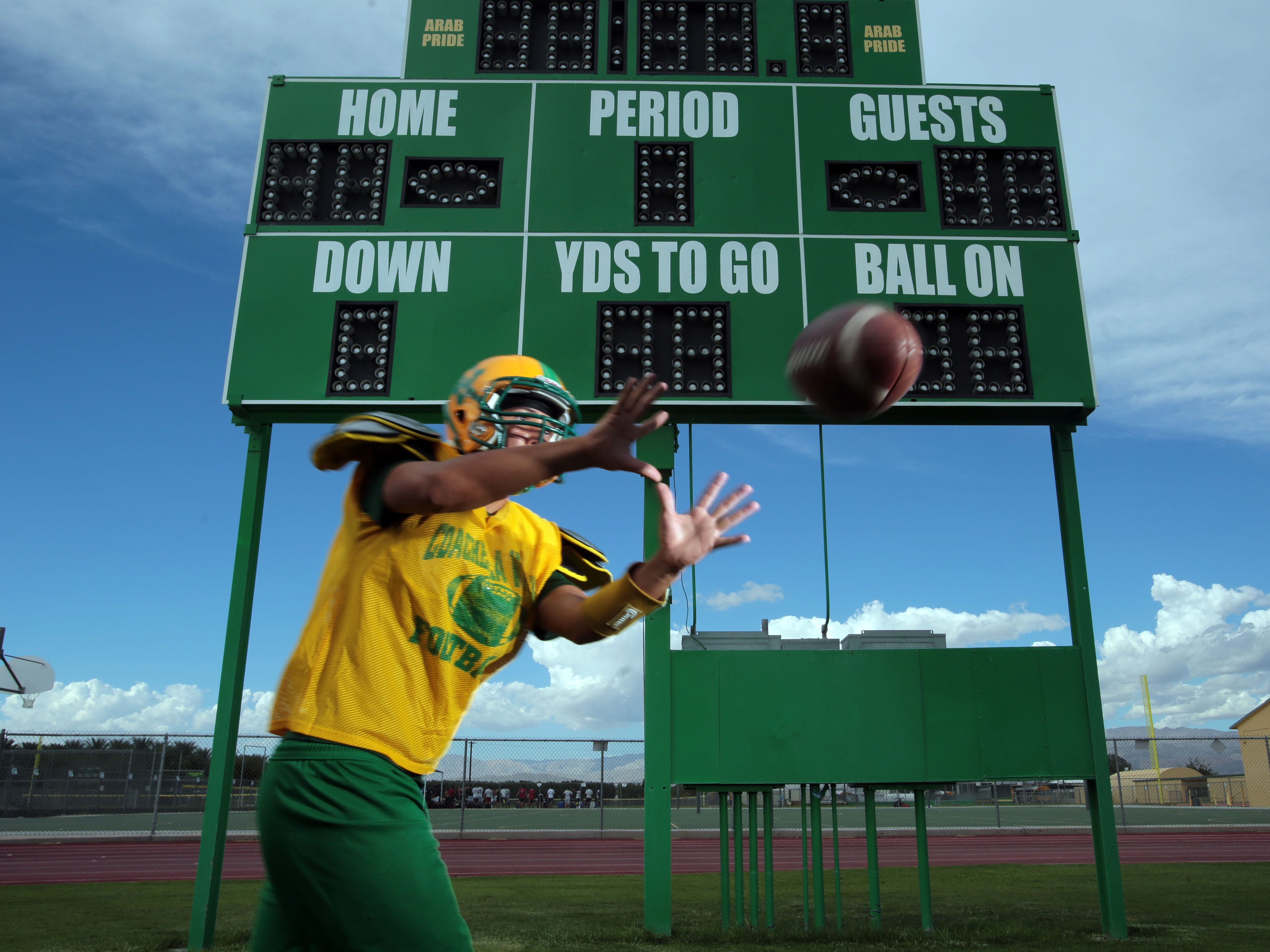 Coachella Valley's Carlos Espinoza makes a catch on Wednesday, September 17, 2014 in Thermal ahead of their game with Desert Mirage. (Setup photo)