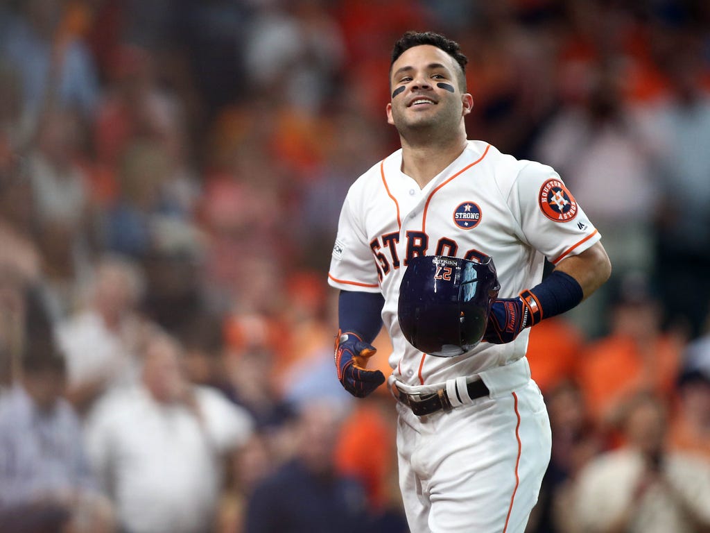 Houston Astros second baseman Jose Altuve celebrates after hitting a solo home run during the seventh inning against the Boston Red Sox in game one of the 2017 ALDS playoff baseball series at Minute Maid Park in Houston.