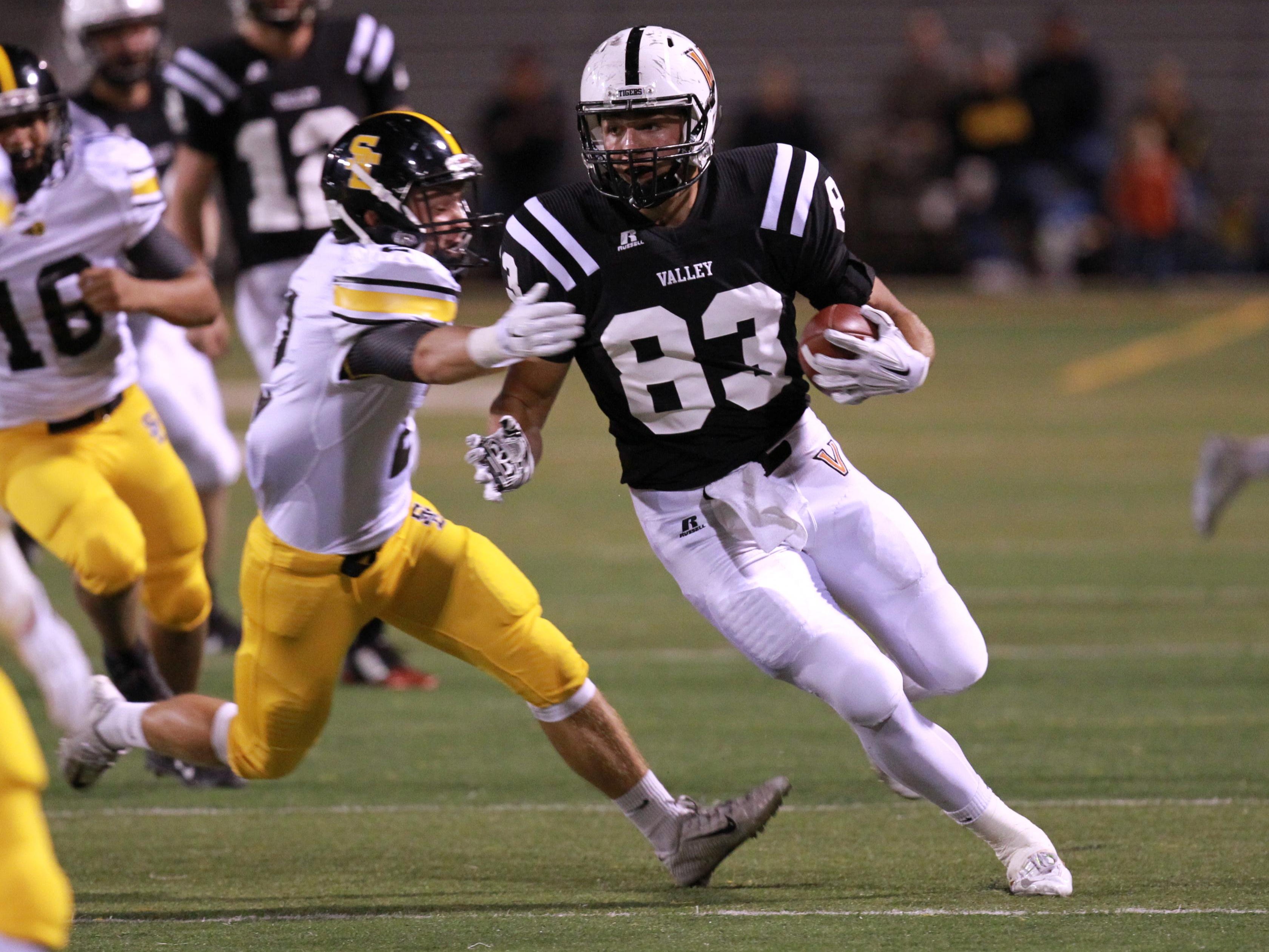 September 11, 2015; West Des Moines, IA, USA; West Des Moines Valley Tigers John Gliniecki catches a pass for a first down against the SE Polk Rams. Reese Strickland- For the Des Moines Register