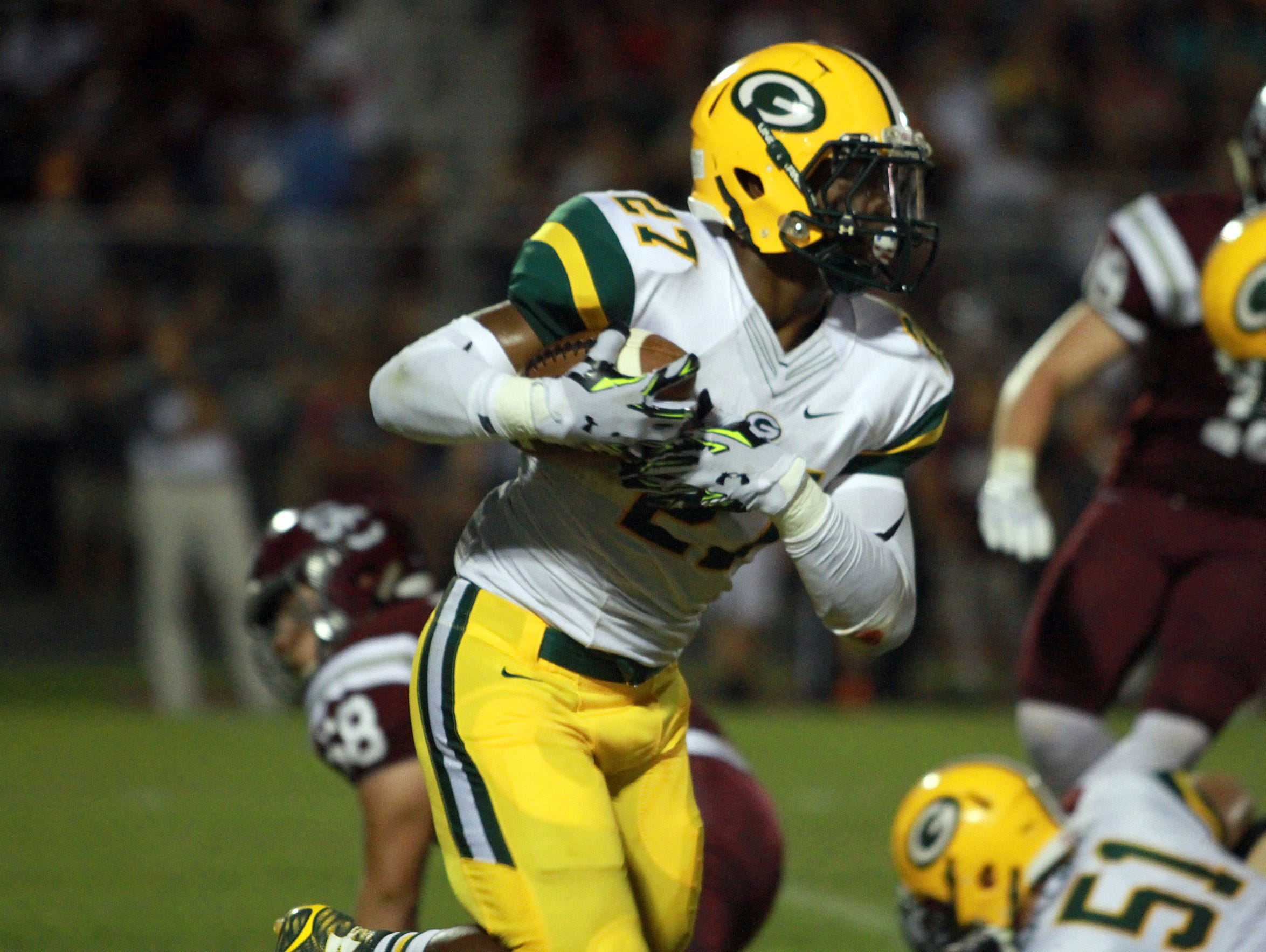 Gallatin running back Jordan Mason rushes against Station Camp during Friday's game. Mason rushed for 298 yards and three touchdowns on 40 carries in the Green Wave's 34-27 victory.