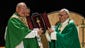 Pope Francis presents a gift to Cardinal Timothy Dolan,