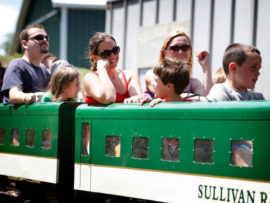 Sullivan Railroad passengers enjoy a trip on the one-mile