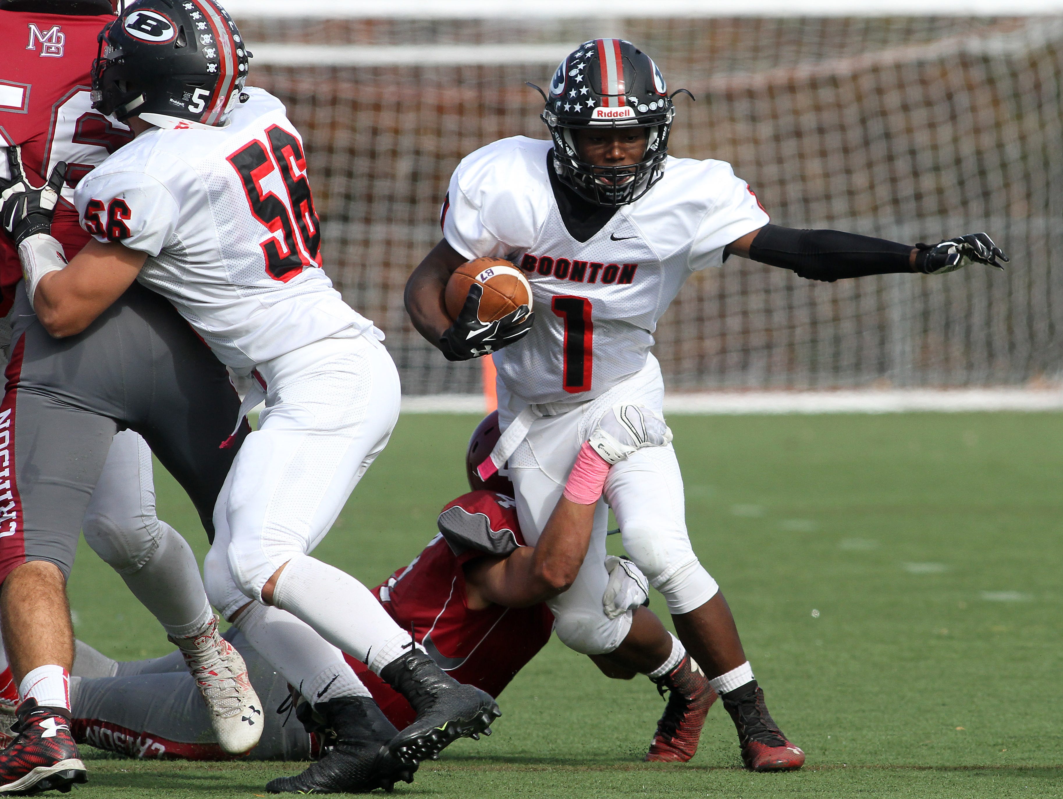 Boonton halfback T.J. Green gains yardage vs. Morristown Beard during their football matchup October 31, 2015, Morristown, NJ.
