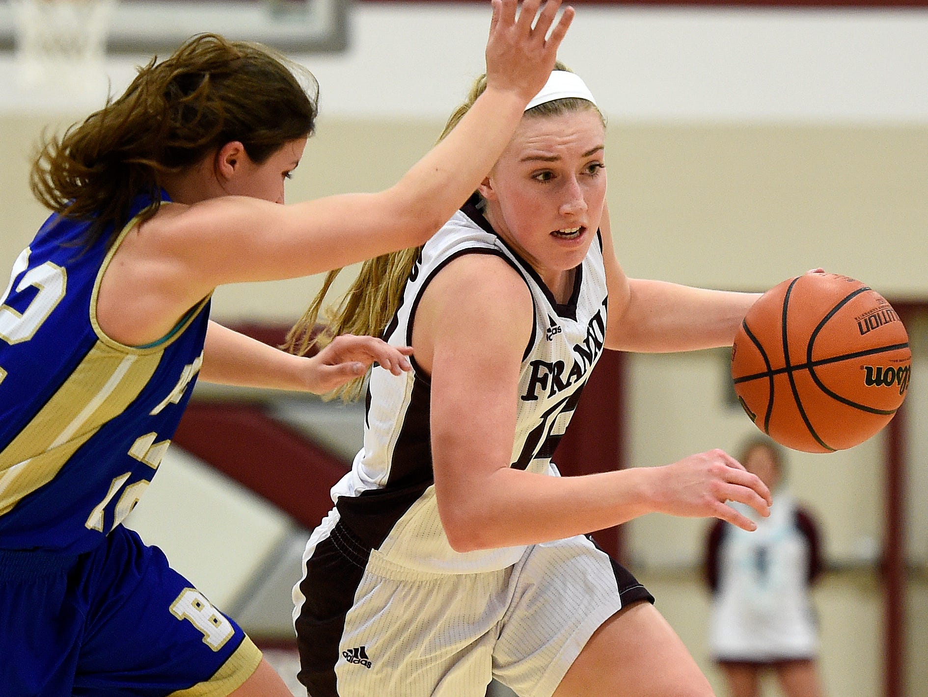 Franklin's Holly Harris (12) advances past Brentwood's Abby Shealy (22) during the first half at Franklin High School, Tuesday, Feb. 16, 2016, in Franklin, Tenn.