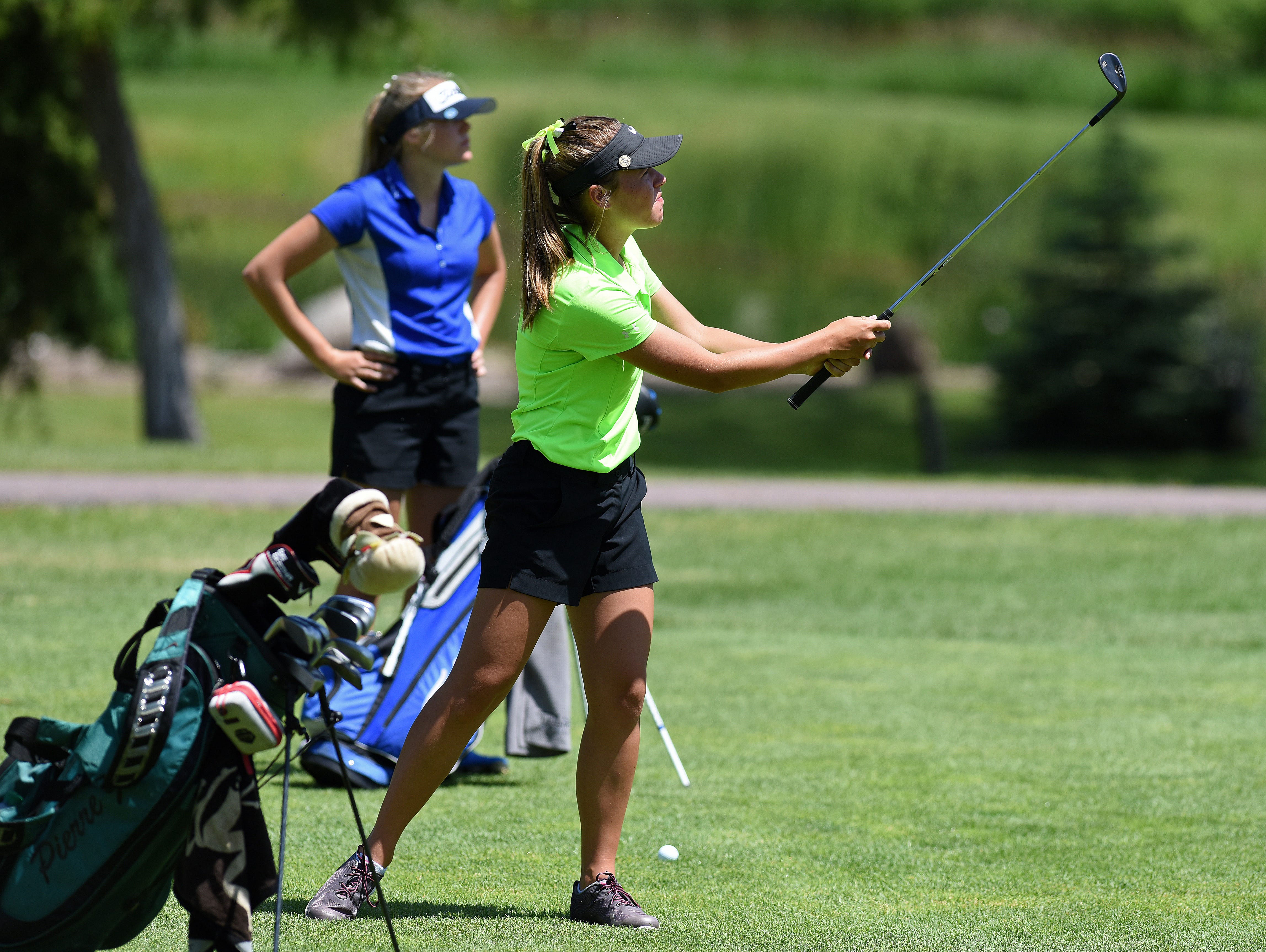 Pierre's Katie Barlett and RCS's Natalie Young golf during the girls state golf tournament at Lakeview Golf Course in Mitchell, S.D., Tuesday, June 7, 2016.