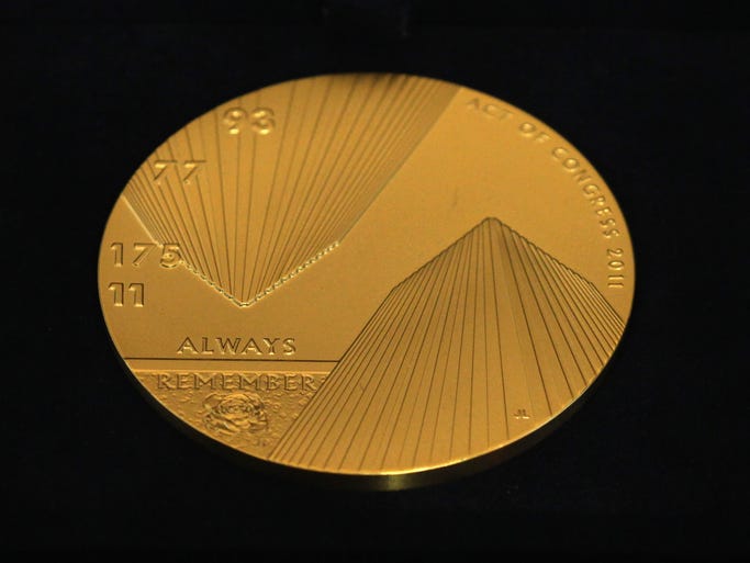 A Congressional Gold Medal honors victims of the terror attack in New York is displayed on Wednesday during a Congressional Gold Medal presentation ceremony at the Emancipation Hall. The medal is the highest civilian award bestowed by Congress.