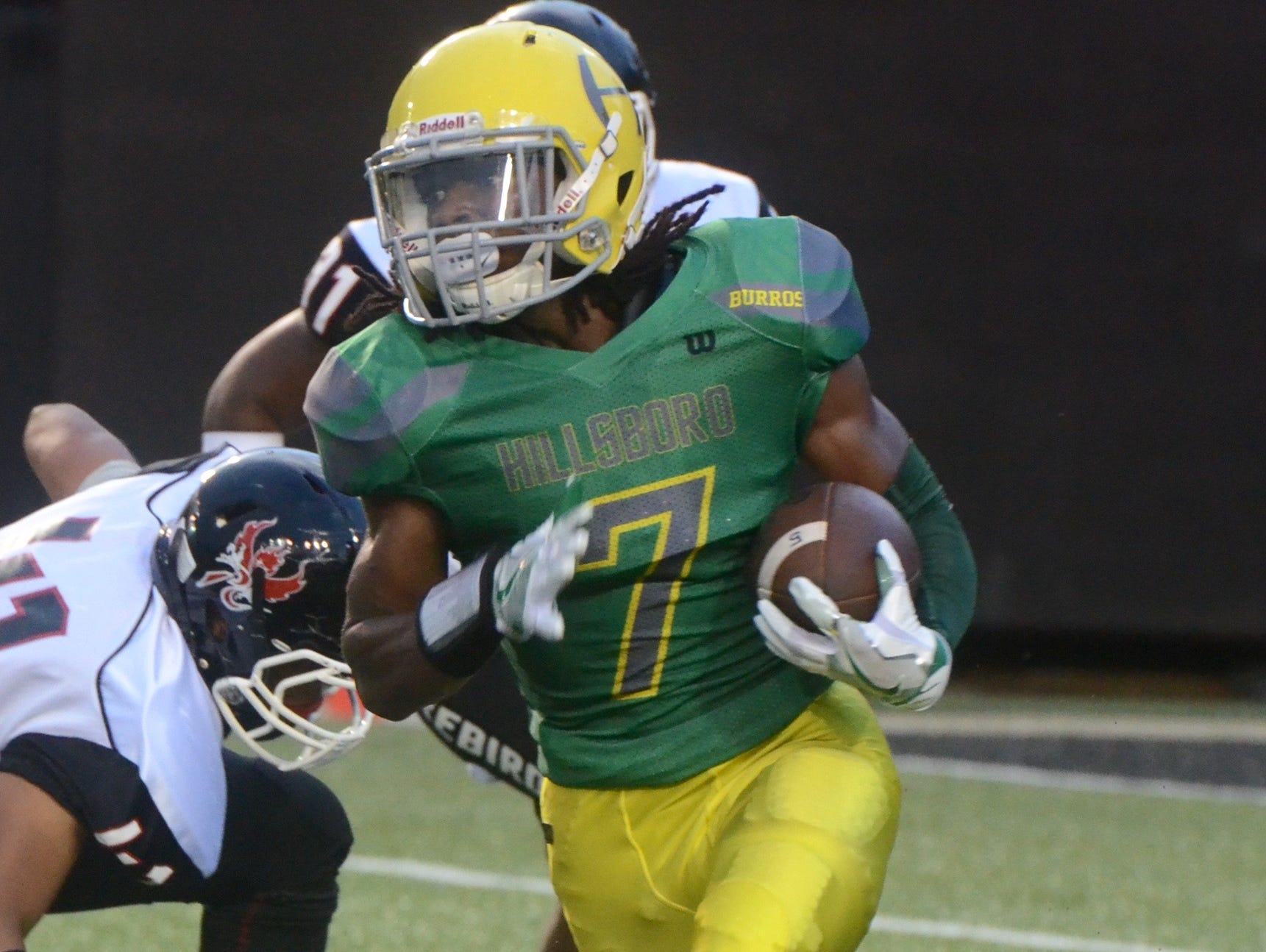 Hillsbro running back Barrion Claybrooks picks up some first-half running room during Saturday's game against Hillsboro.