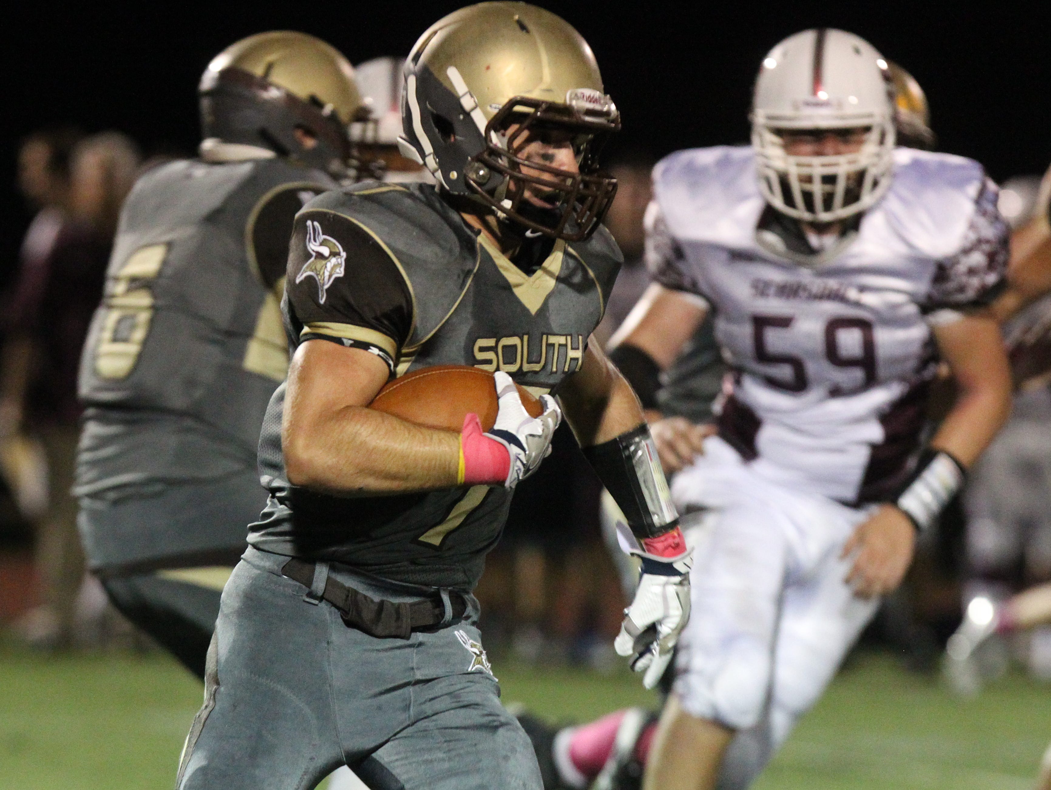 Clarkstown South's Sam Mistretta is pursued by Scarsdale's Dylan Quirk during their game at Clarkstown South Oct. 7, 2016.