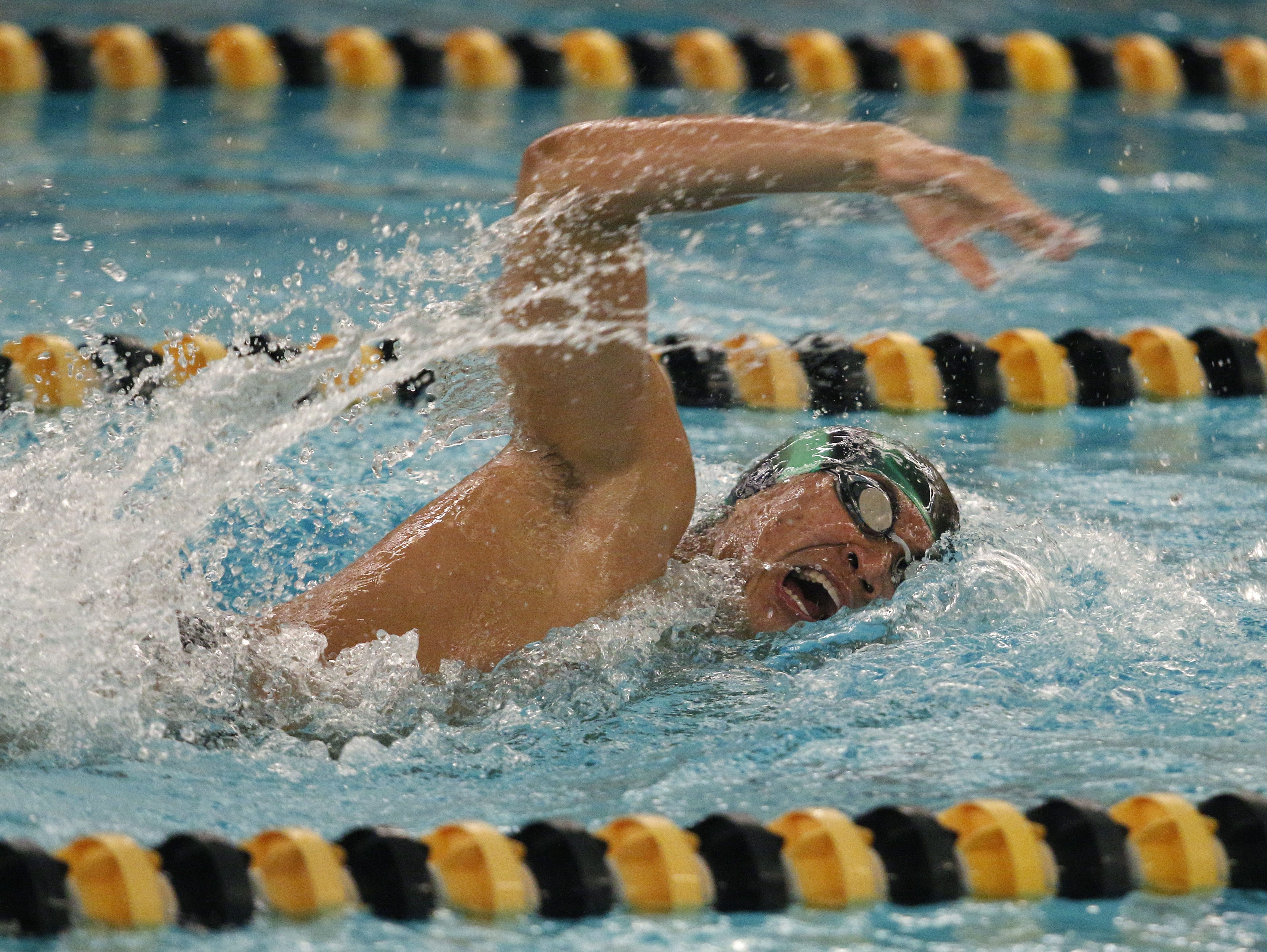 An Okemos swimmer anchors the 500 Freestyle Crescendo in the Waverly Relays Wednesday, Dec. 7, 2016, at Waverly High School.