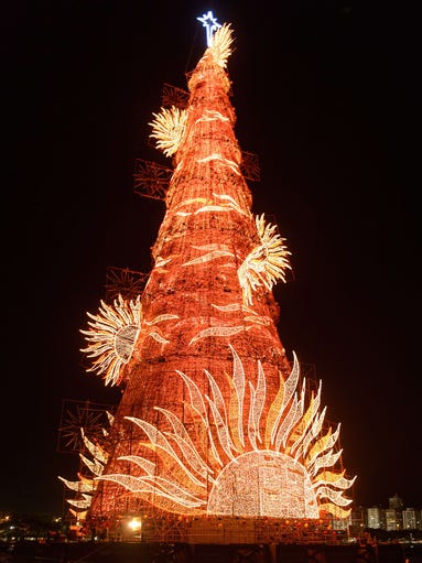 A 85-meter-high floating Christmas tree illuminates