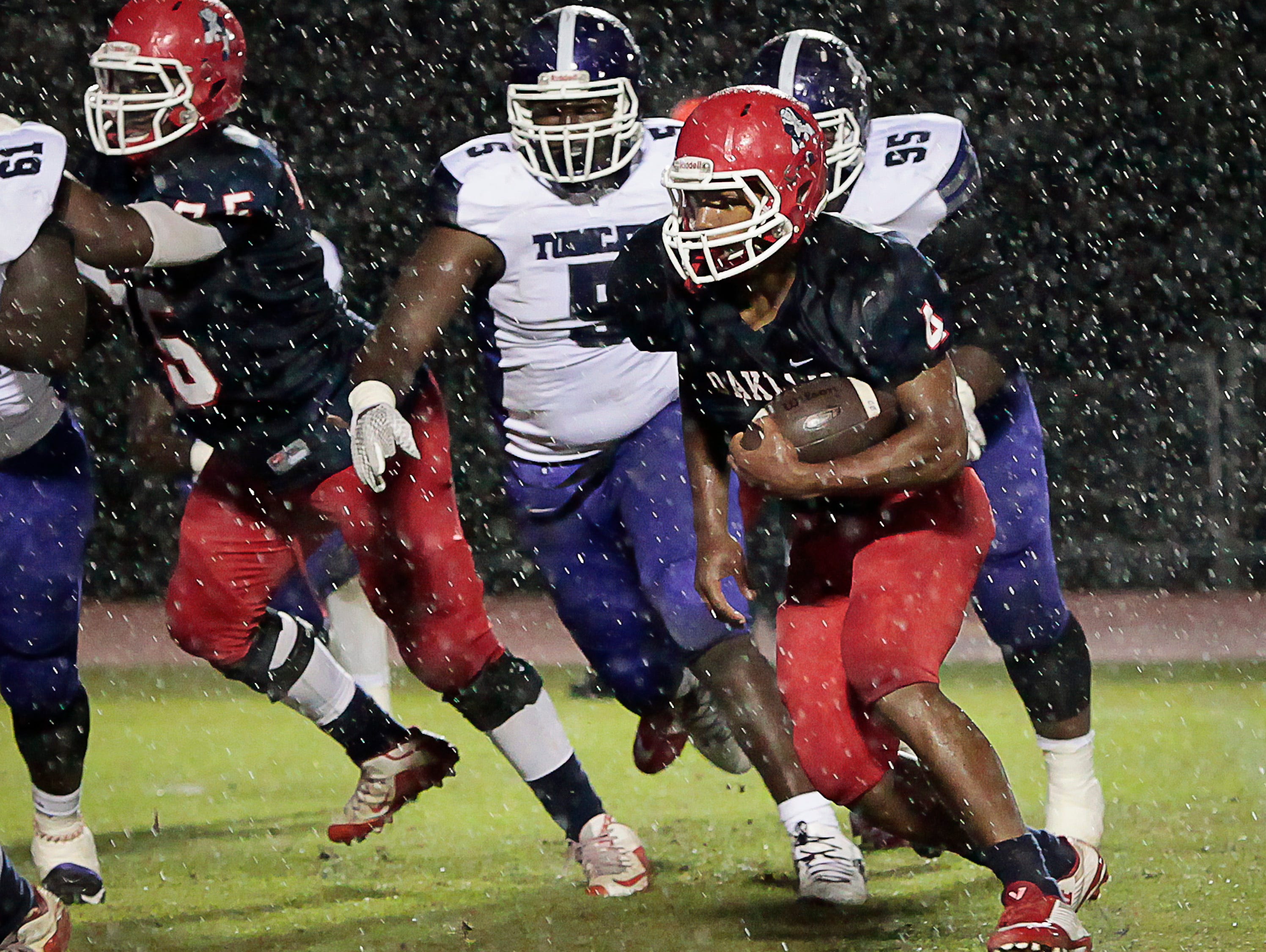 Oakland’s Lazarius Patterson (4) scored four touchdowns in the Patriots’ 49-6 win Friday night.