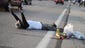 A man lies in the middle of the street in protest during a peaceful protest on West Florissant Avenue.