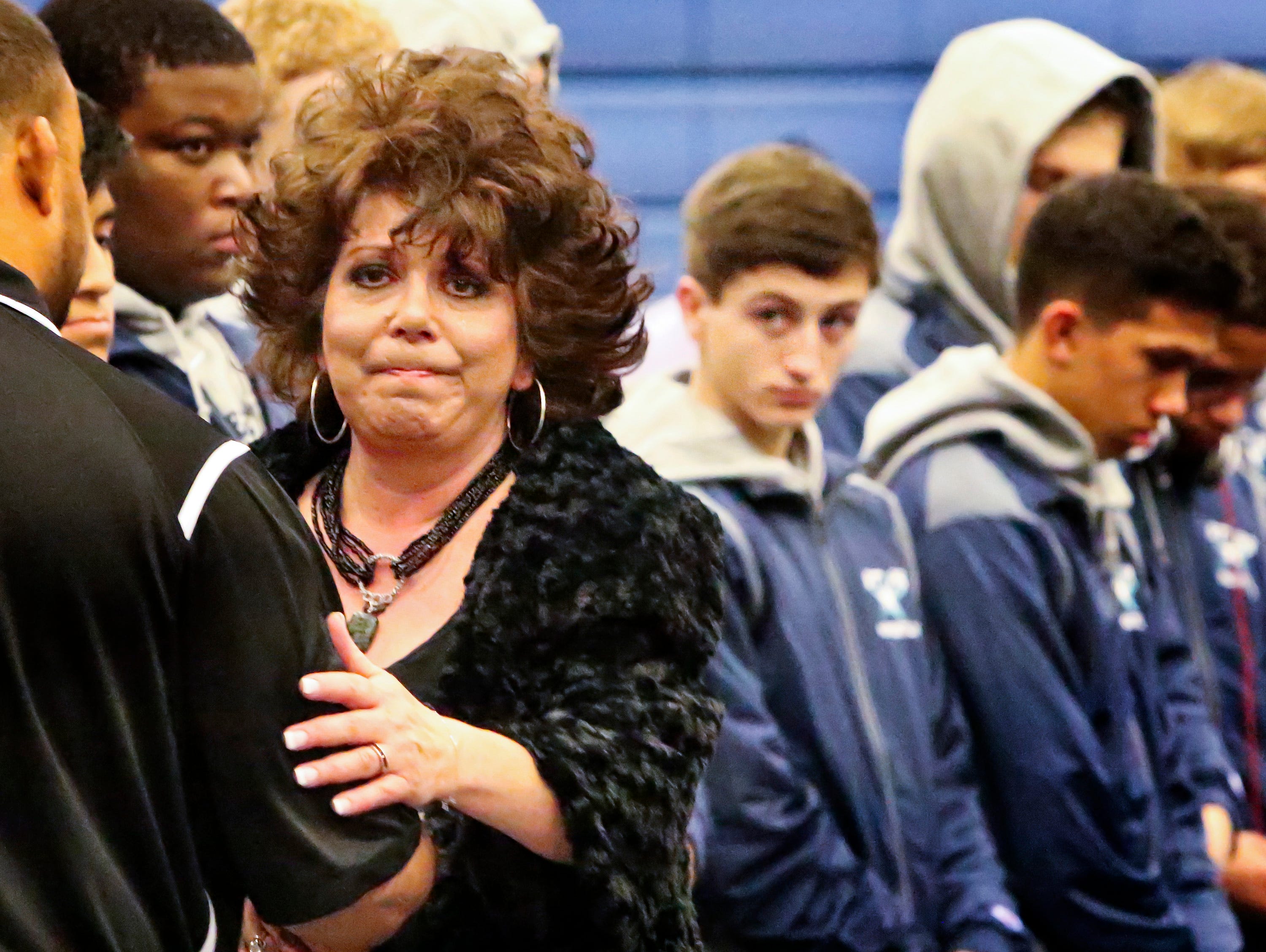 Melanie Loupe was honored prior to Siegel's first home wrestling match Wednesday. Loupe's son Mason, a football player and wrestler, died in September.