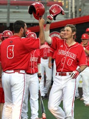 UL's Derek Herrington (8) celebrates with teammate