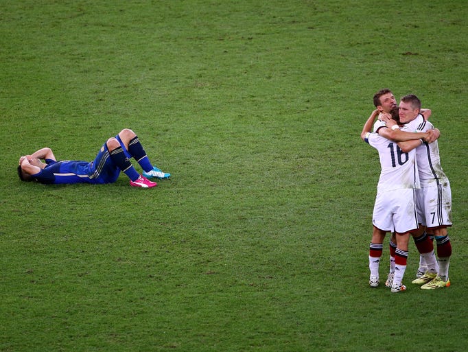Argentina's Sergio Aguero lies on the pitch after losing to Germany in the final.