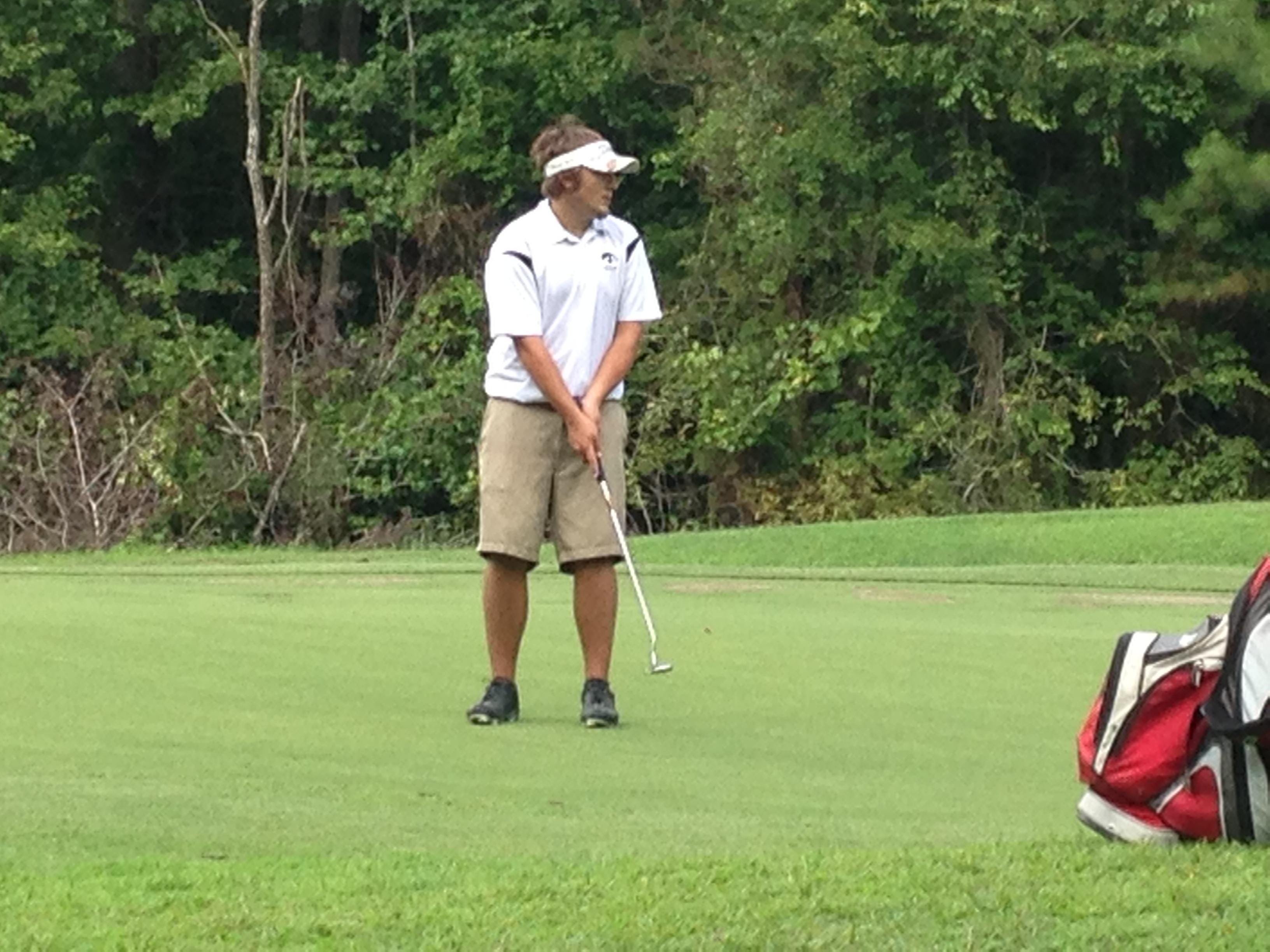 A South Side golfer watches his putt Tuesday at Chickasaw Golf Course.