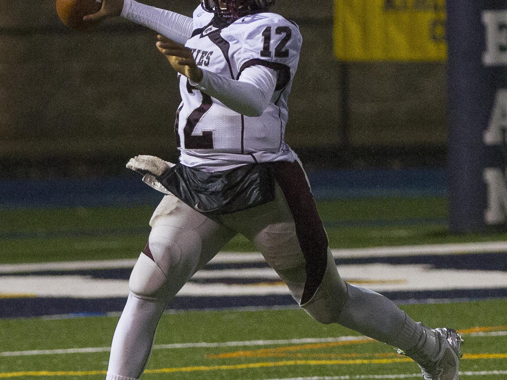 Matawan’s George Pearson throws against Carteret in the Central Group III football championship at Kean University on Dec. 5, 2014.