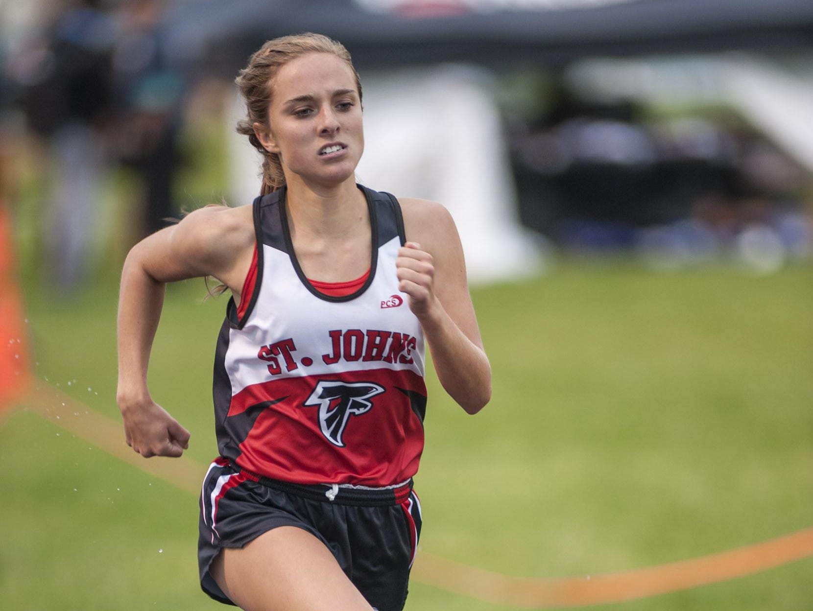 Karrigan Smith repeated as the Division 2 state champion in the 1,600 run and helped St. Johns capture a team state title.