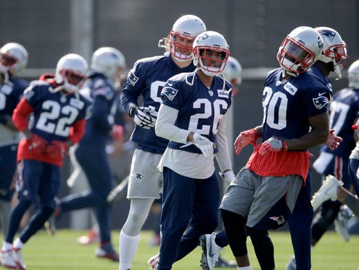 New England Patriots players participate in a drill
