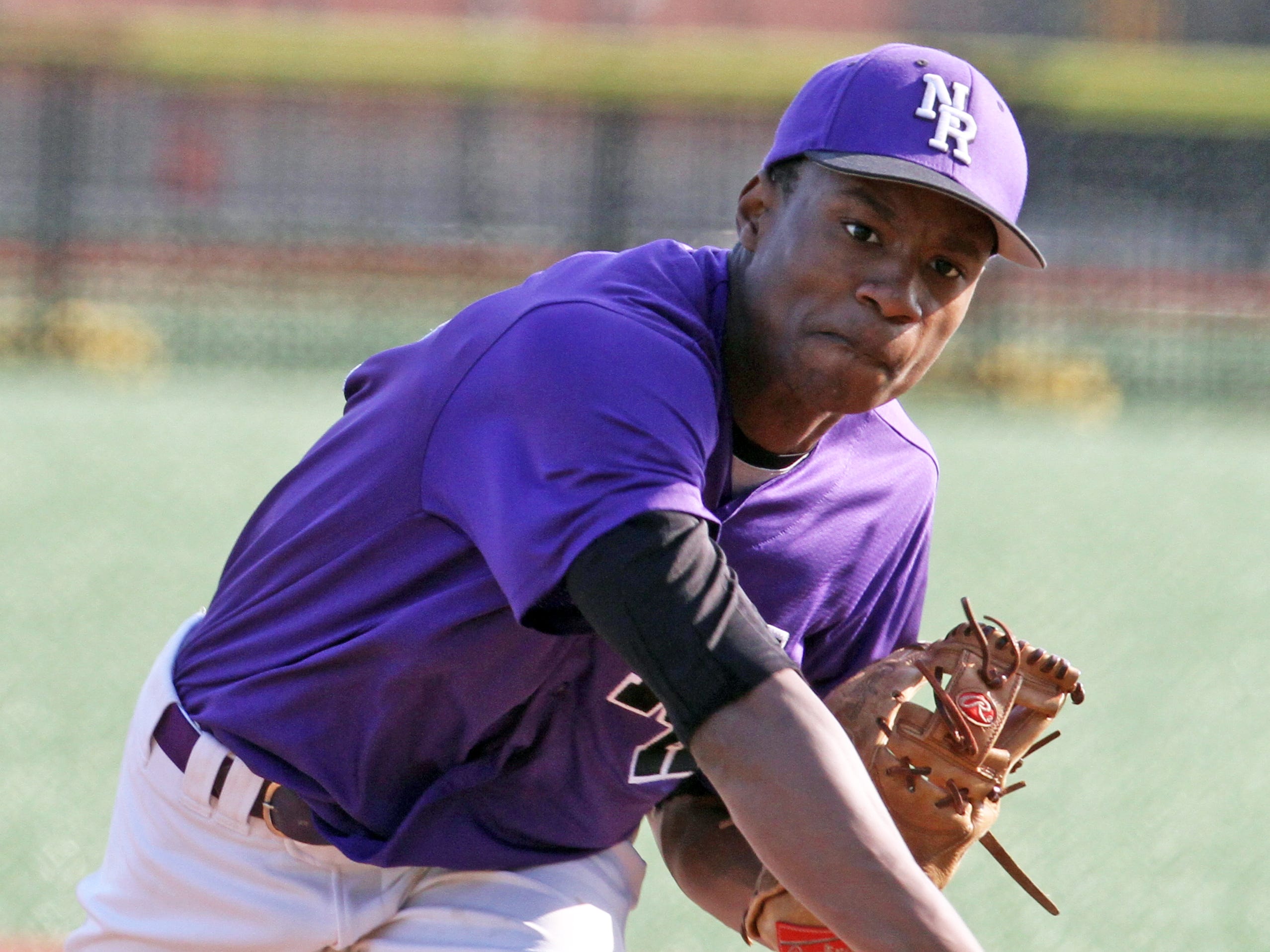 New Rochelle's JoJo Gray struck out ten batters over 8 1/3 innings as Mamaroneck defeated New Rochelle 2-1 in nine innings in a varsity baseball game at City Park in New Rochelle April 21, 2015. Gray held Mamaroneck scoreless for eight innings, but gave up two runs in the ninth to take the loss.