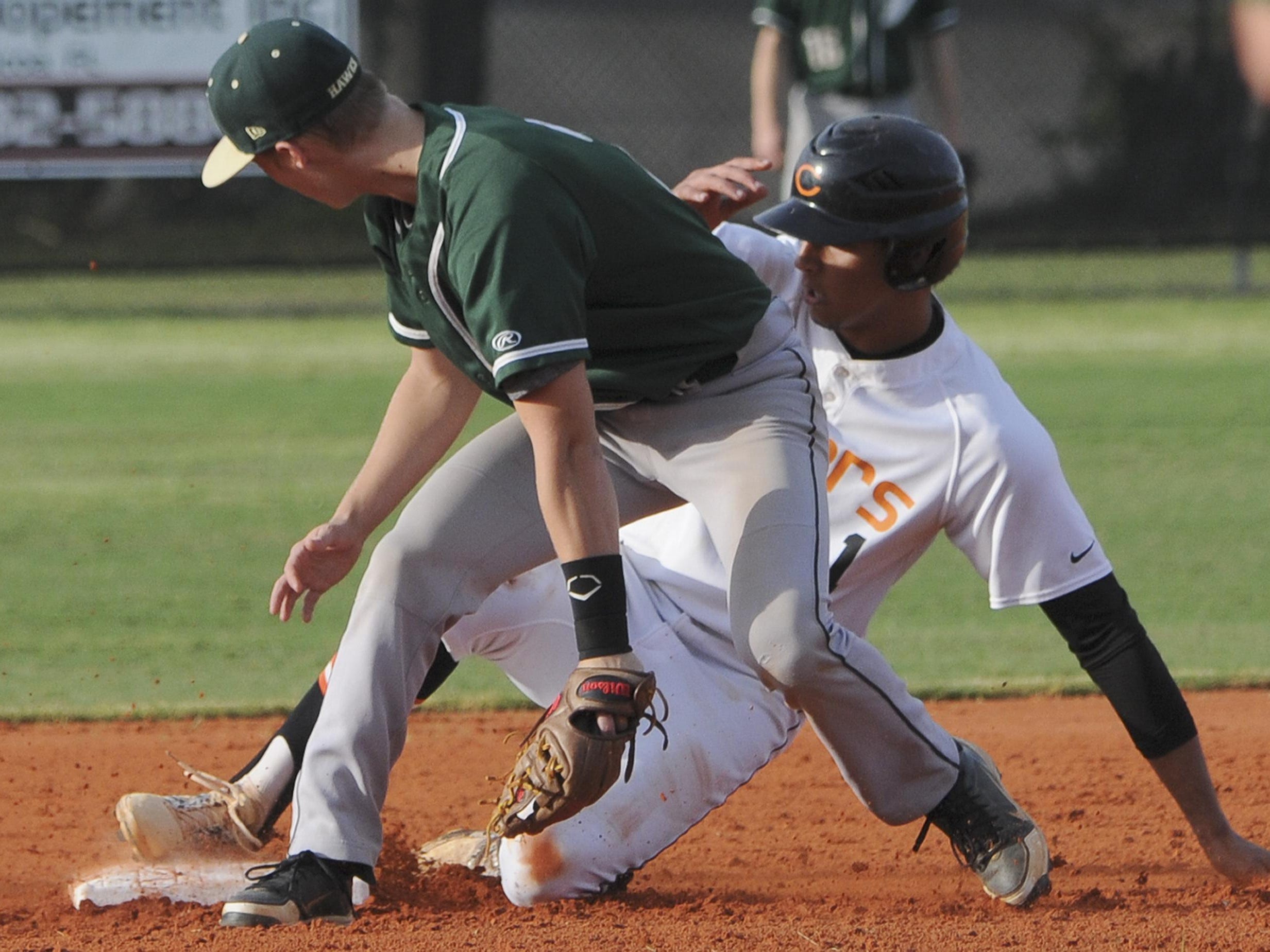 Cocoa's Zach Armour safely makes it to second before the tag by Brody Legate of Viera during Wednesday's game.