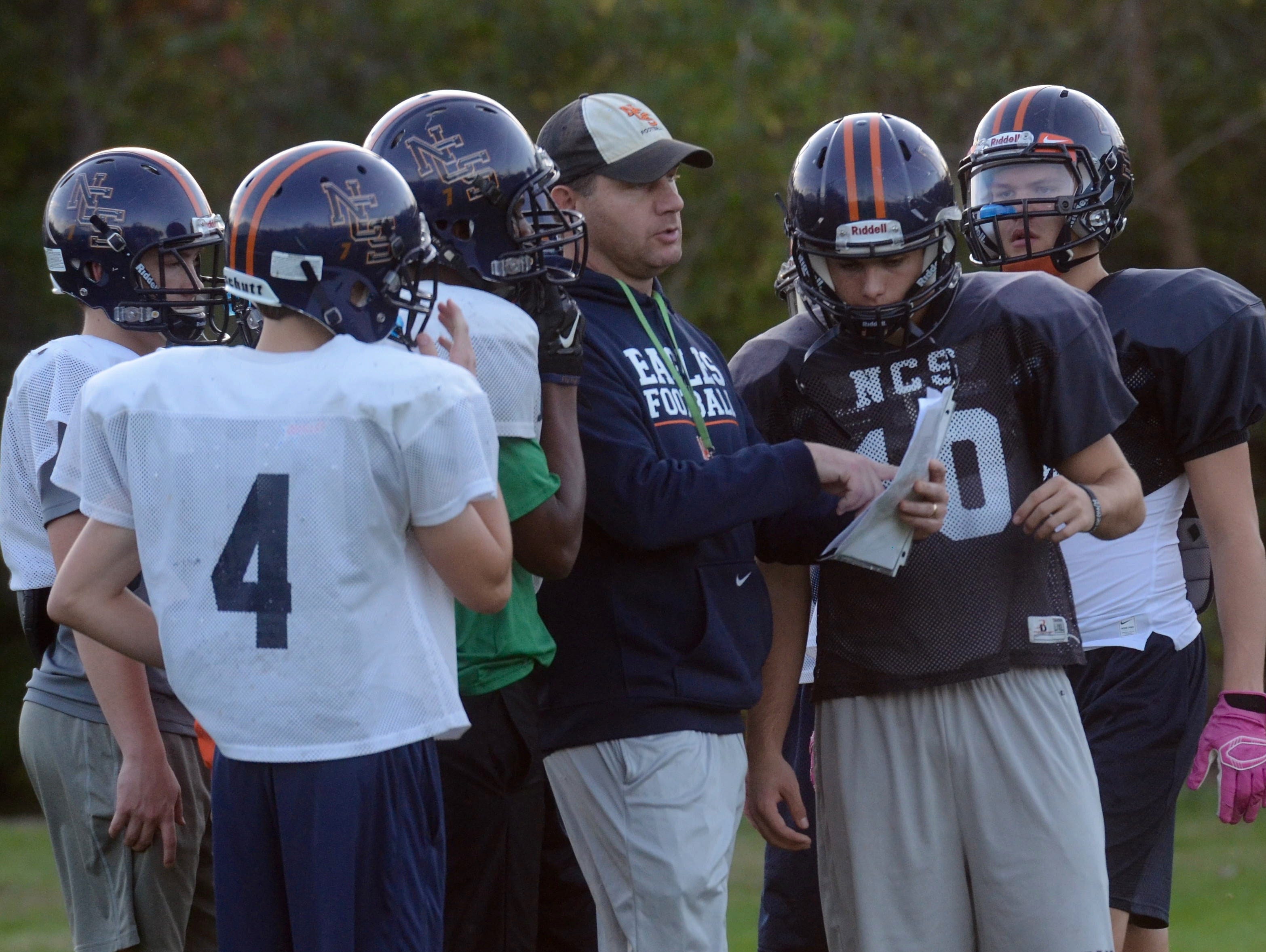 Nashville Christian coach Jeff Brothers (center) coaches his players during Wednesday's practice.
