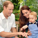 Catherine, Duchess of Cambridge holds Prince George as he points to a butterfly on Prince William, Duke of Cambridge's hand as they visit the Sensational Butterflies exhibition at the Natural History Museum   in London.
