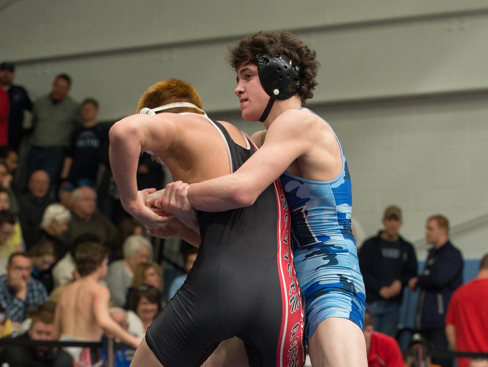 Middletown's Dante Immediate, right wrestles William Penn's Thien Nguyen in the 126 pound quarterfinals at the DIAA Individual State Tournament at Cape Henlopen High School.